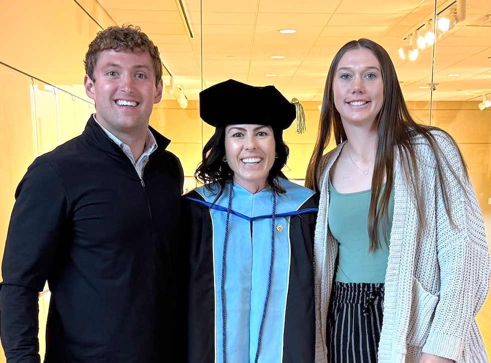 2025 Character Athletes of the Year Hunter Preston and Kaitlyn Powell with Dr. Liza Johnson, Director of the Wendt Center